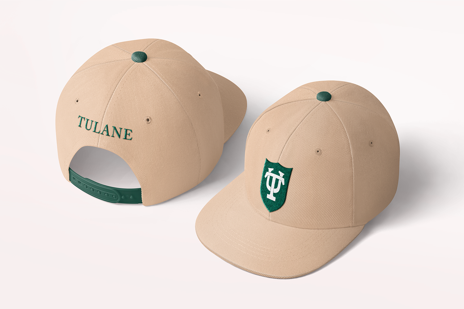 Beige baseball cap with white Tulane logo on green shield on the front and green wordmark on the back